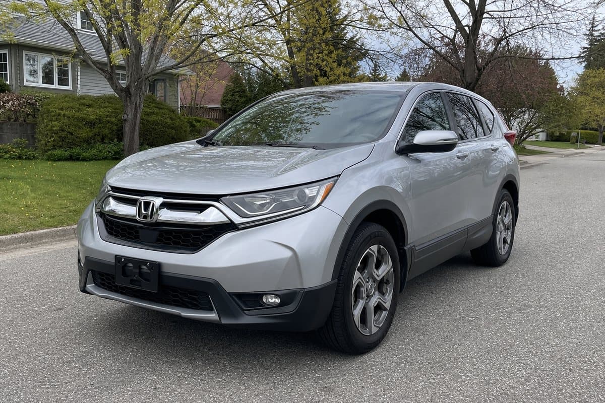 A silver Honda CR-V parked on a suburban street